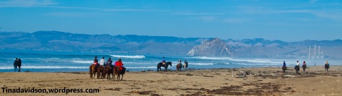 Horse back riders near Sandspit beach at Montana De Oro State Park, CA